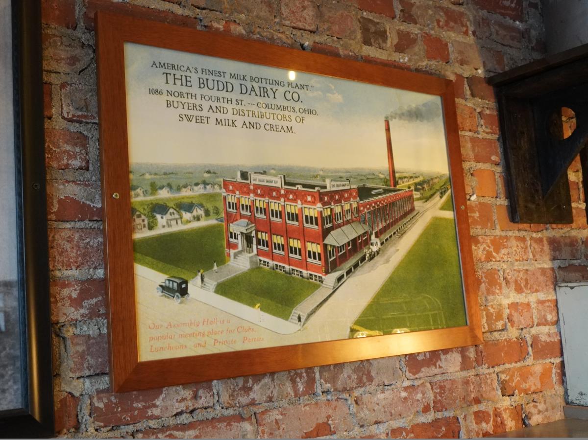 Old post card hanging at Budd Dairy Food Hall showing the space used to be an assembly hall