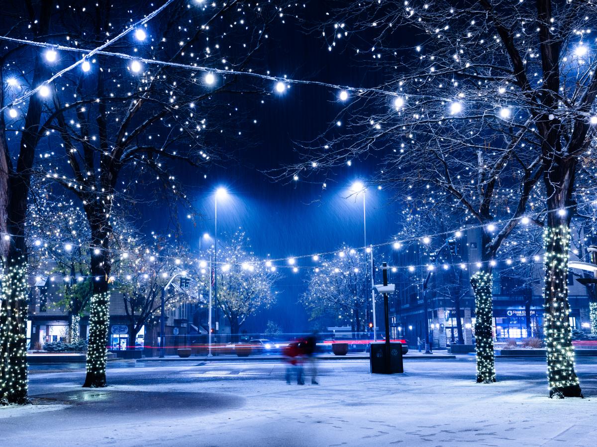A plaza with lights in the snow