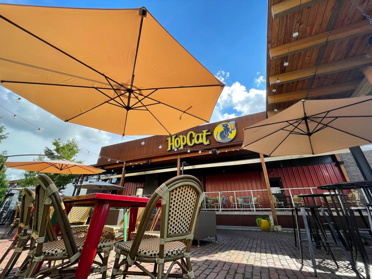 Tables and chairs on the patio at hopcat