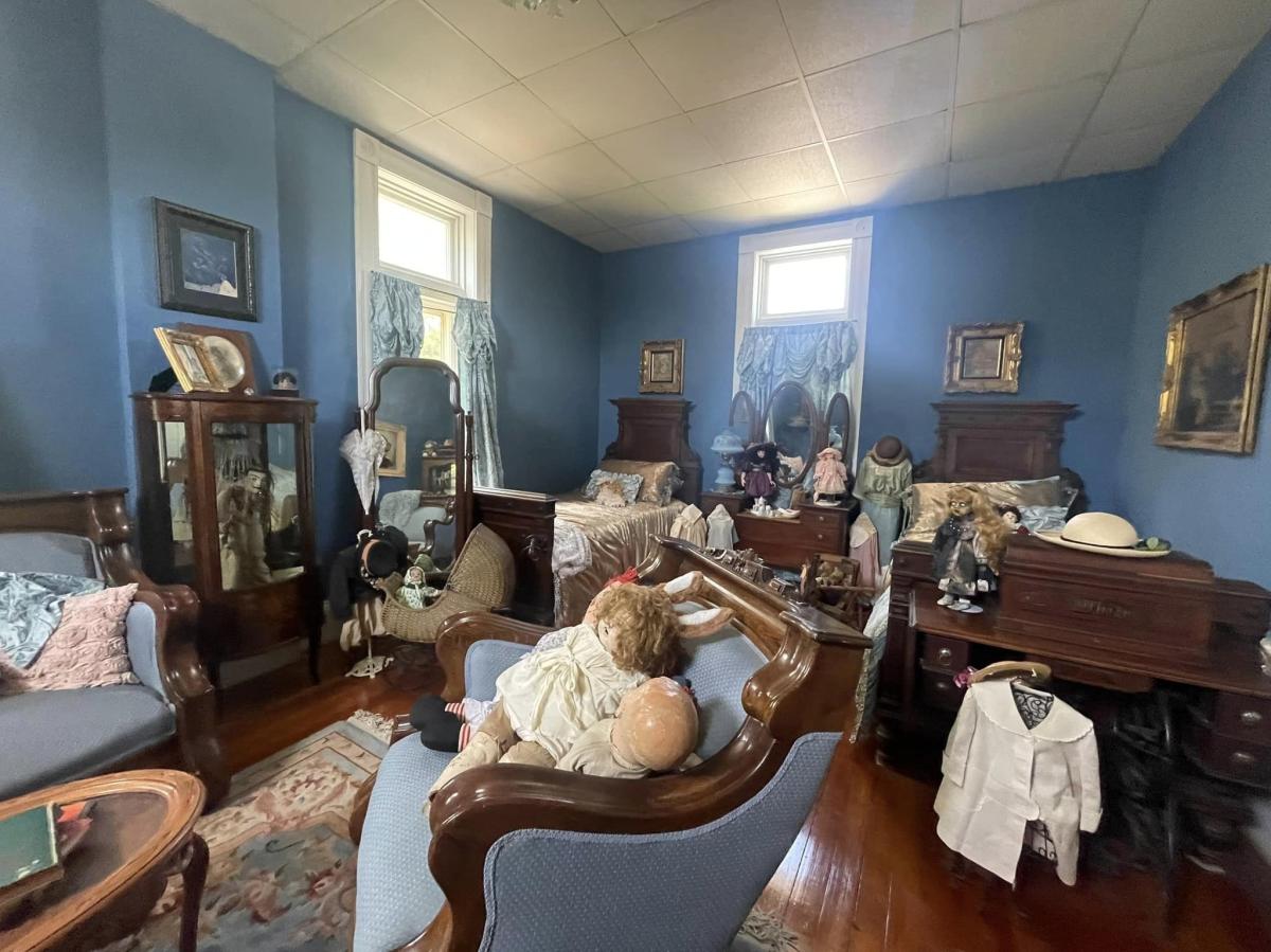 Room with dolls at the haunted 1889 McInteer Villa