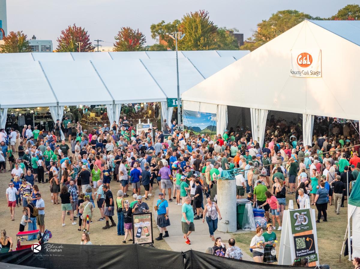 Outdoor event at Michigan Irish Music Festival showing G&L tent with a large crowd of attendees mingling and enjoying the environment.