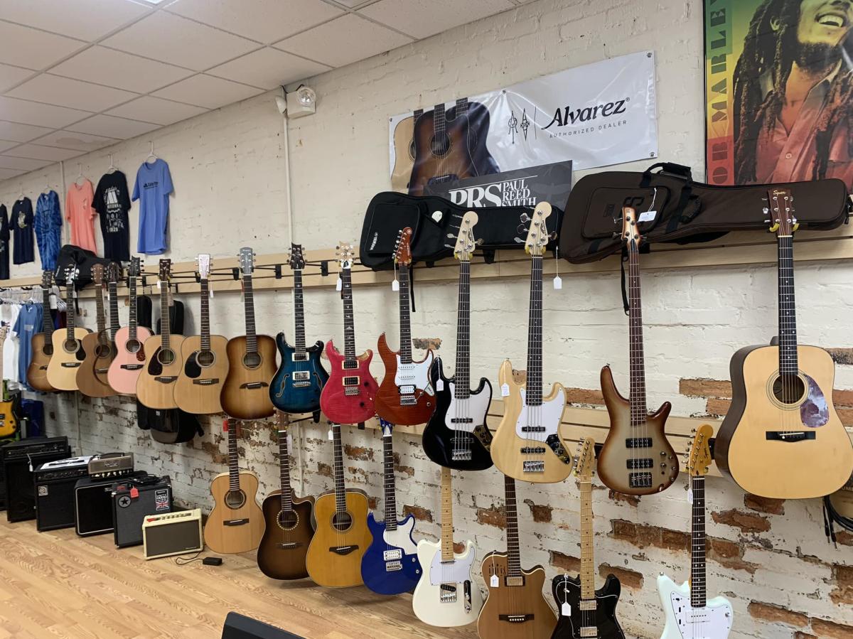 Guitars on wall at The Band Attic in Spencer
