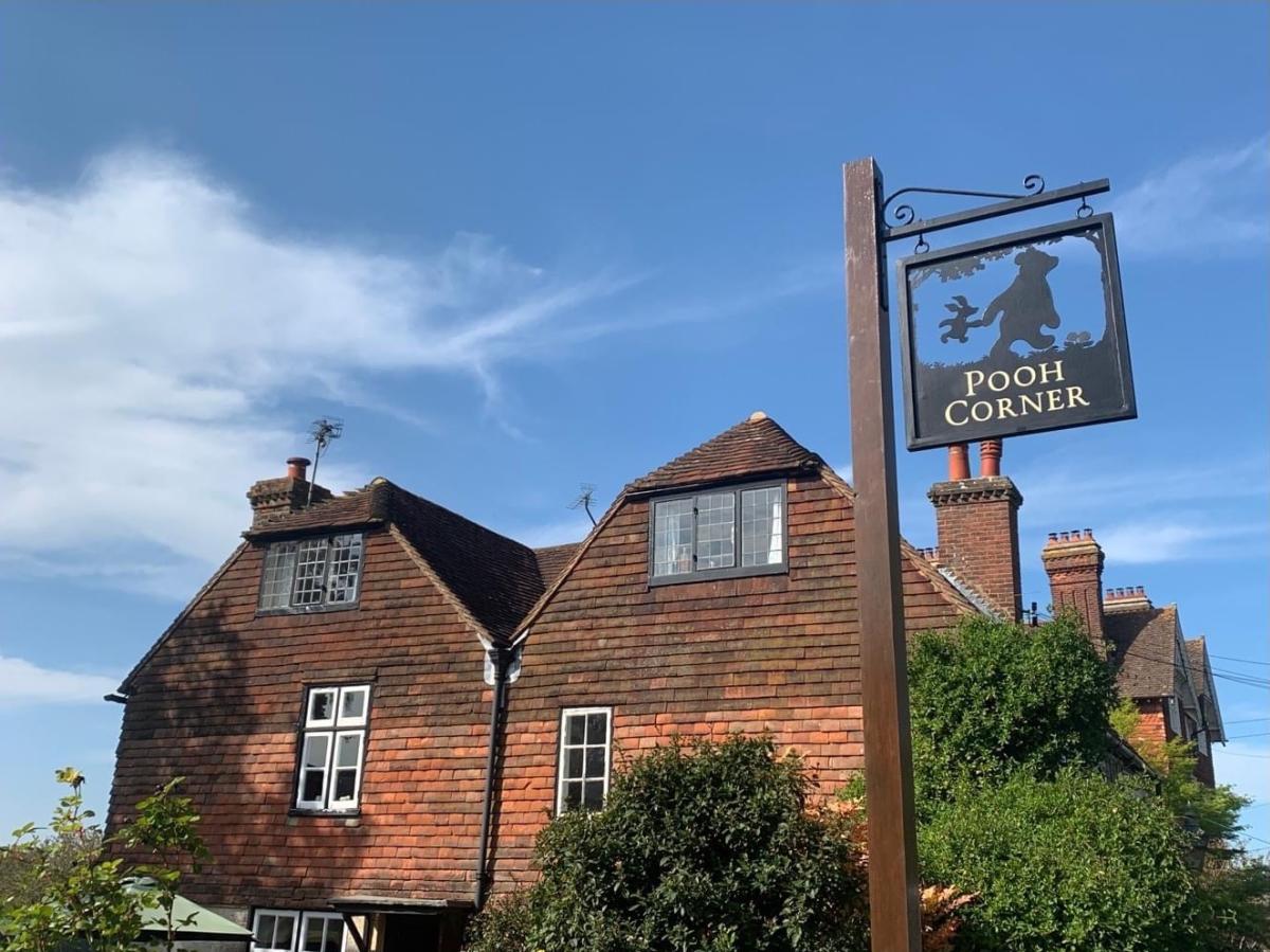 Pooh Corner sign, showing Winnie the Pooh and piglet