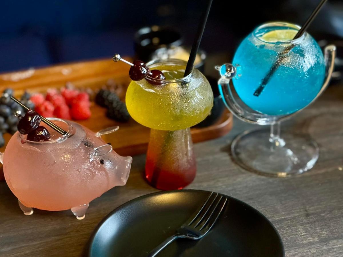 Cocktails are served in fun glasses at Flight 1868