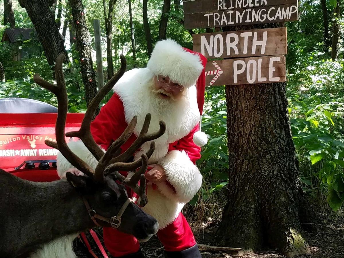 Santa talks to his reindeer at Fulton Valley farms