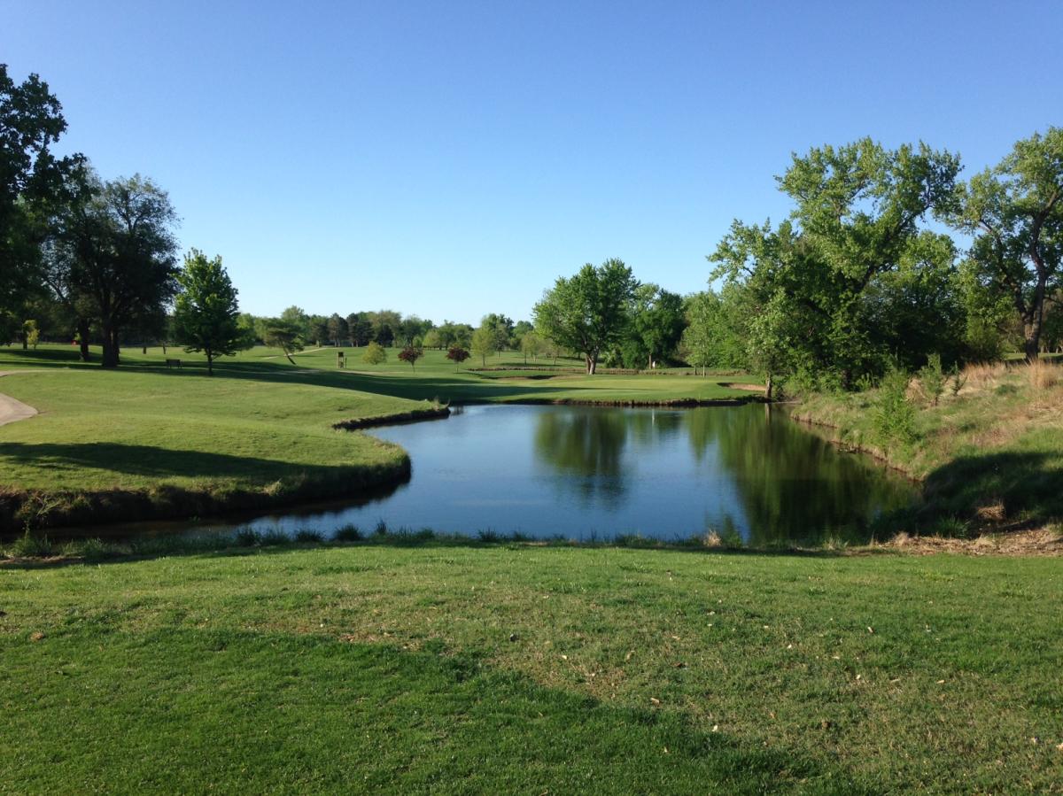 a pond is featured at MacDonald Golf Course on a sunny day in Wichita