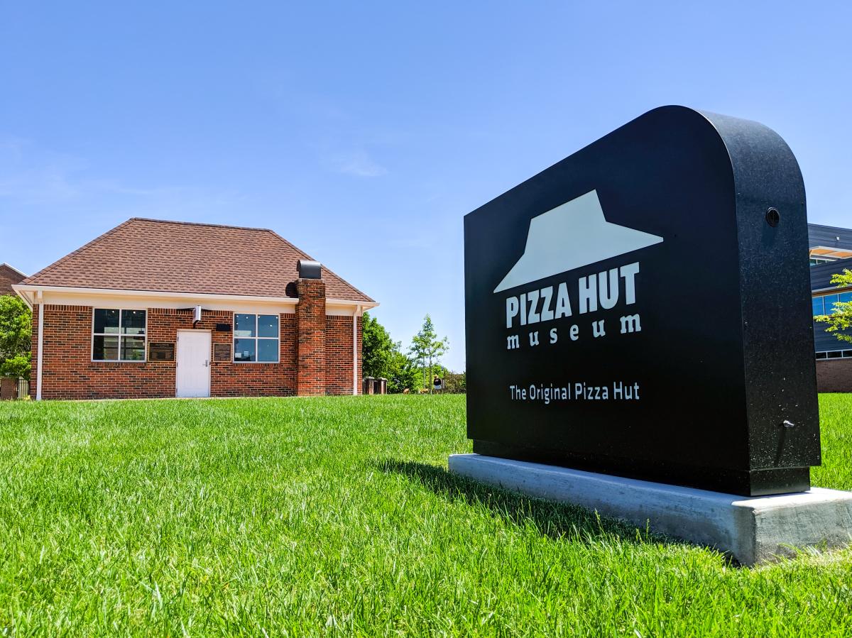 The exterior of the Pizza Hut Museum at the original location is photographed from the exterior