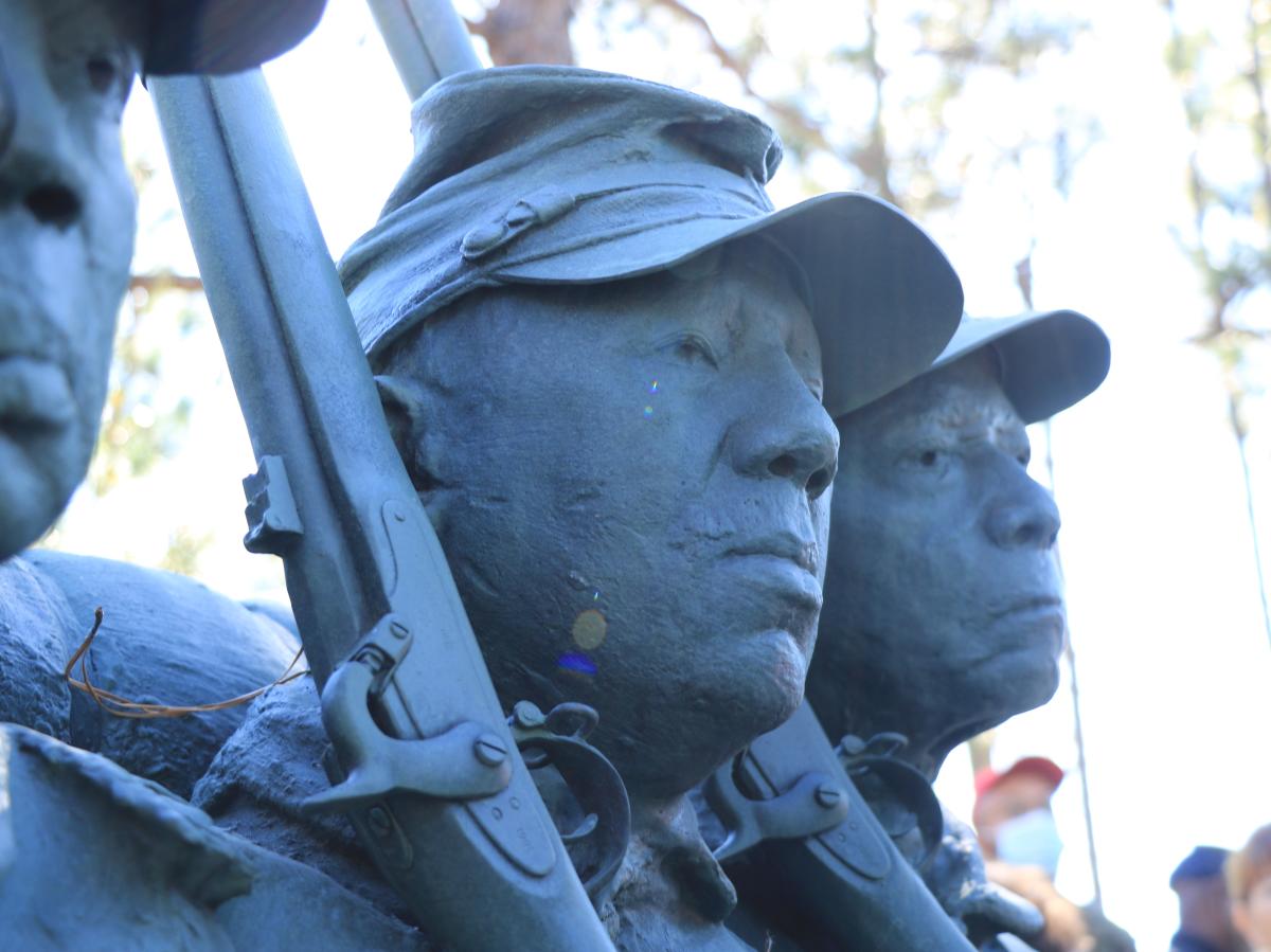 Close up shot of the bronze sculpture commemorating the USCT at Cameron Art Museum.