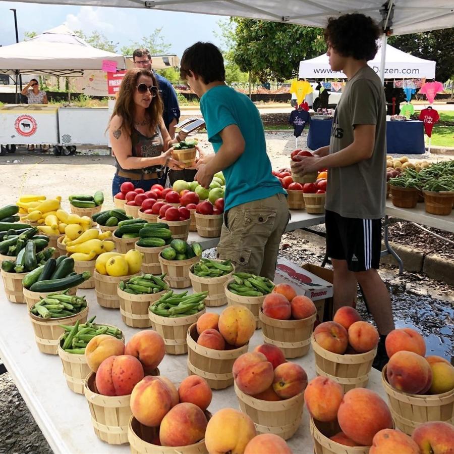 People shopping at the Farmers Market