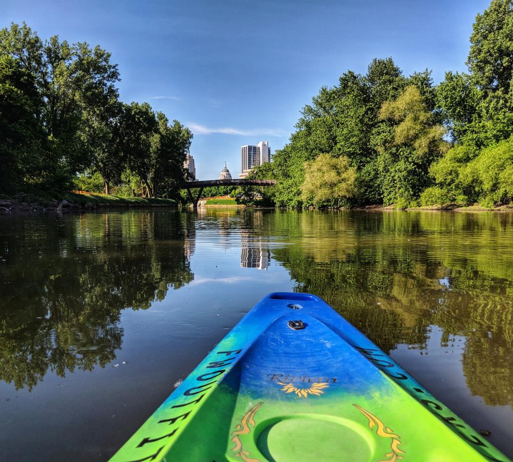 Kayaking Fort Wayne's rivers with a view of the skyline.