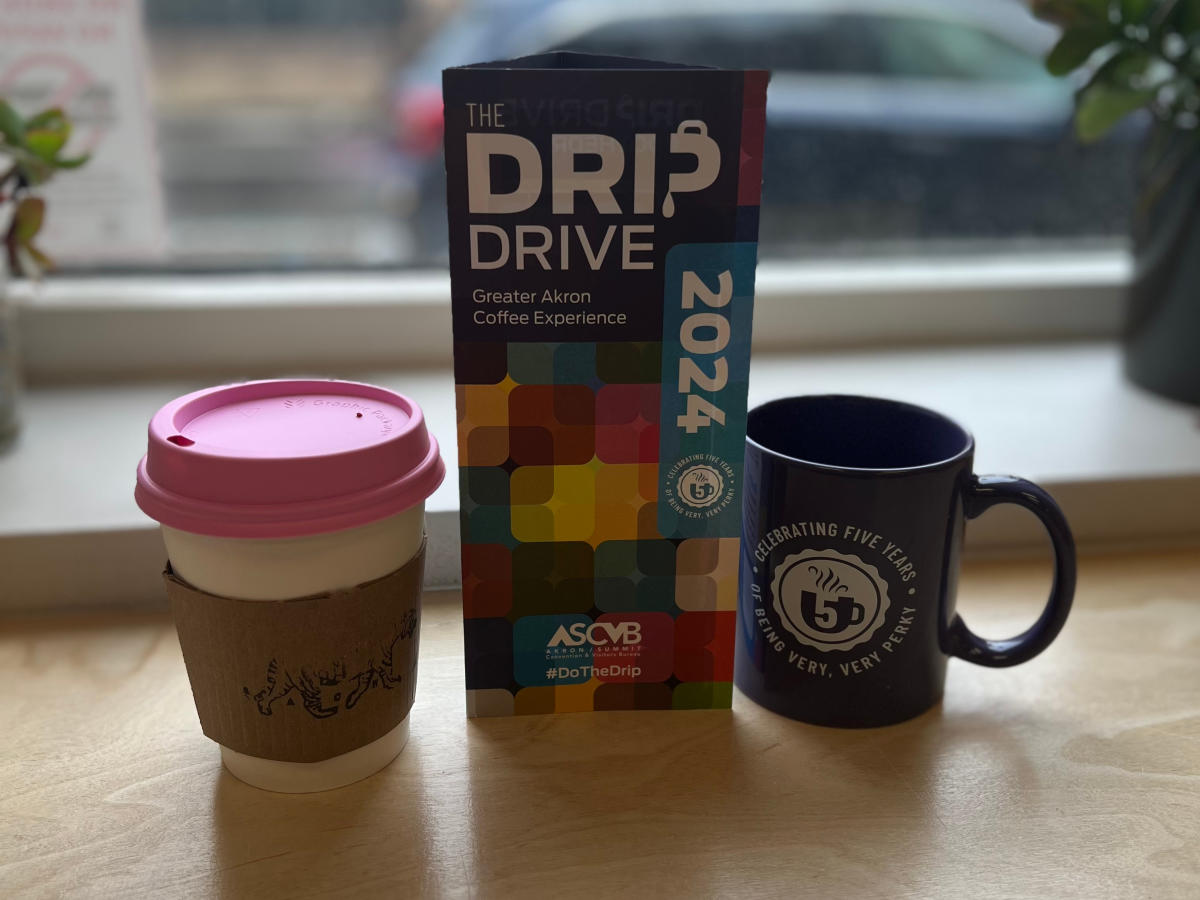Akron Coffee Roasters promotional sign and coffee cups