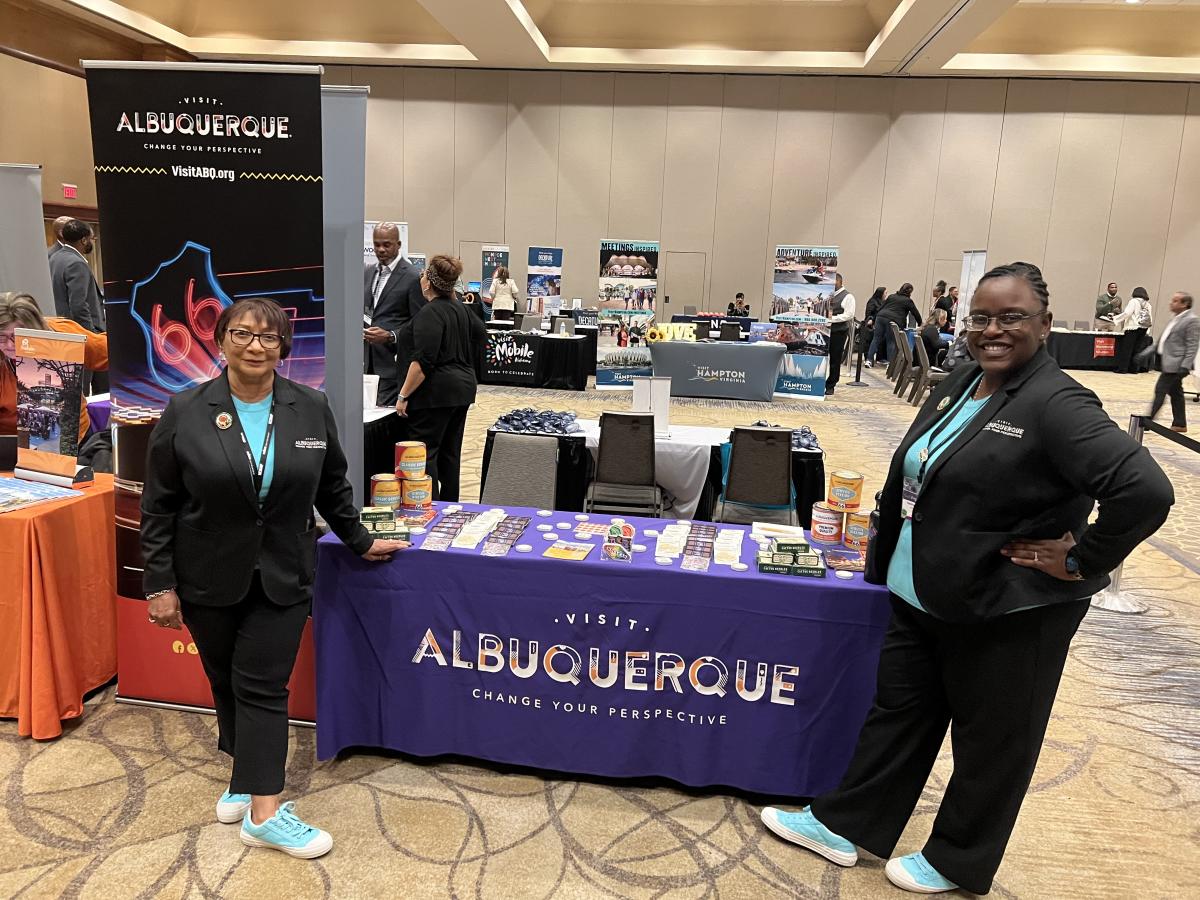 Tabitha Stallworth and Wanda Jackson-Lewis stand at the Visit Albuquerque booth at the National Coalition of Black Meeting Professionals, 2024