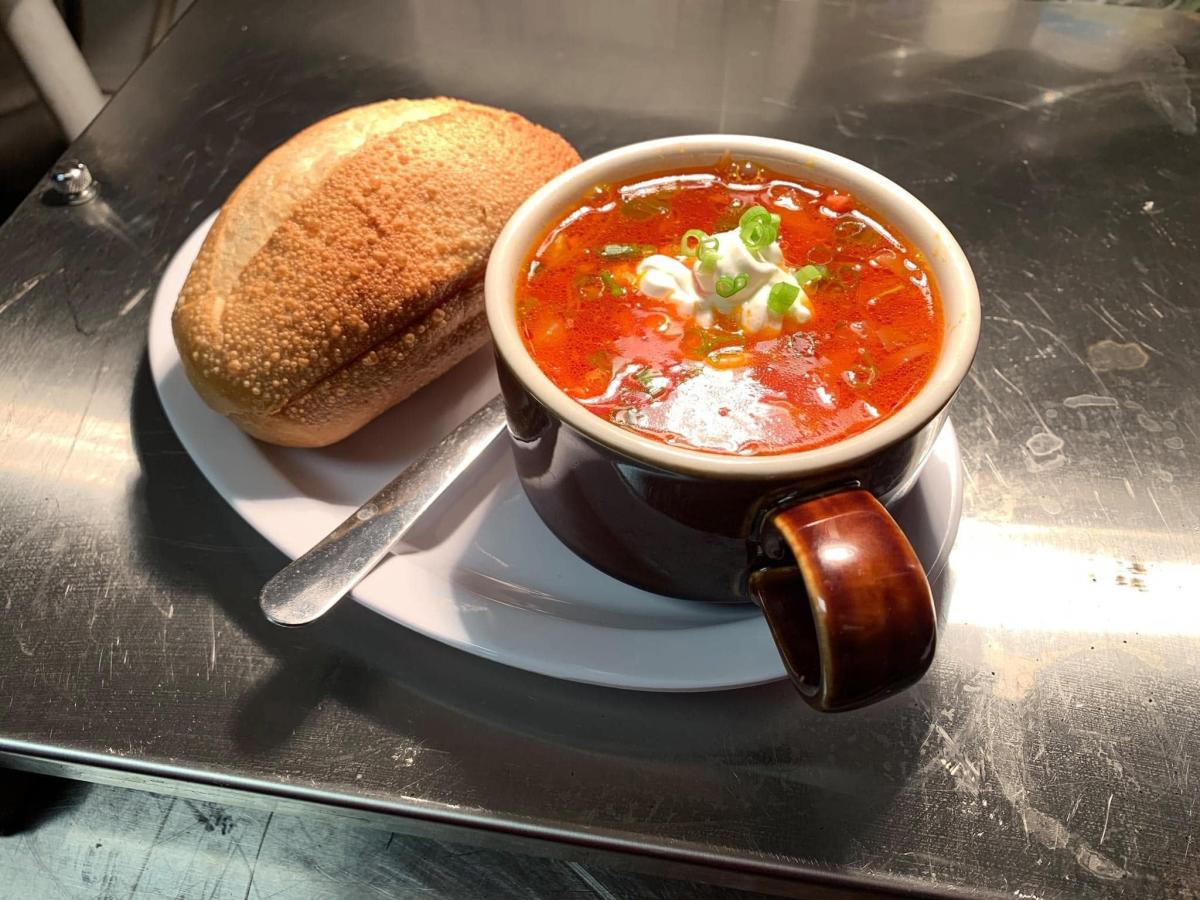 A cup of solanka soup and bread from Red Rock Deli.