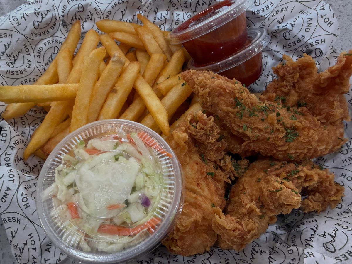 A basket of fried chicken, fries, ketchup and coleslaw from Kokio Korean Fried Chicken.