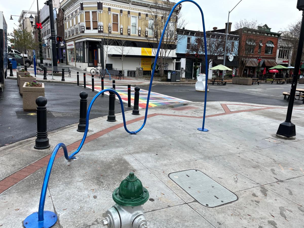 A blue sculpture titled "Frequency" is in downtown Athens.