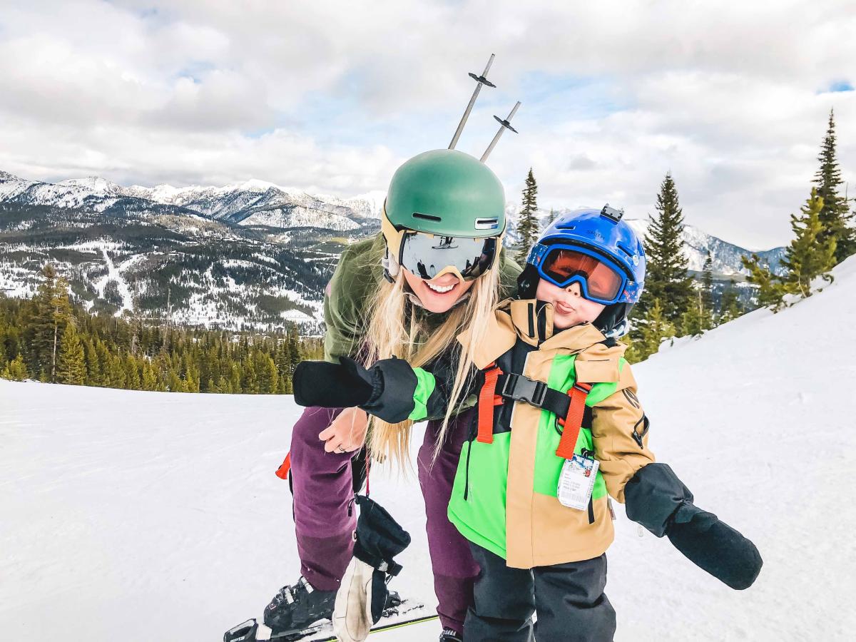 A women and child ski together at Big Sky Resort