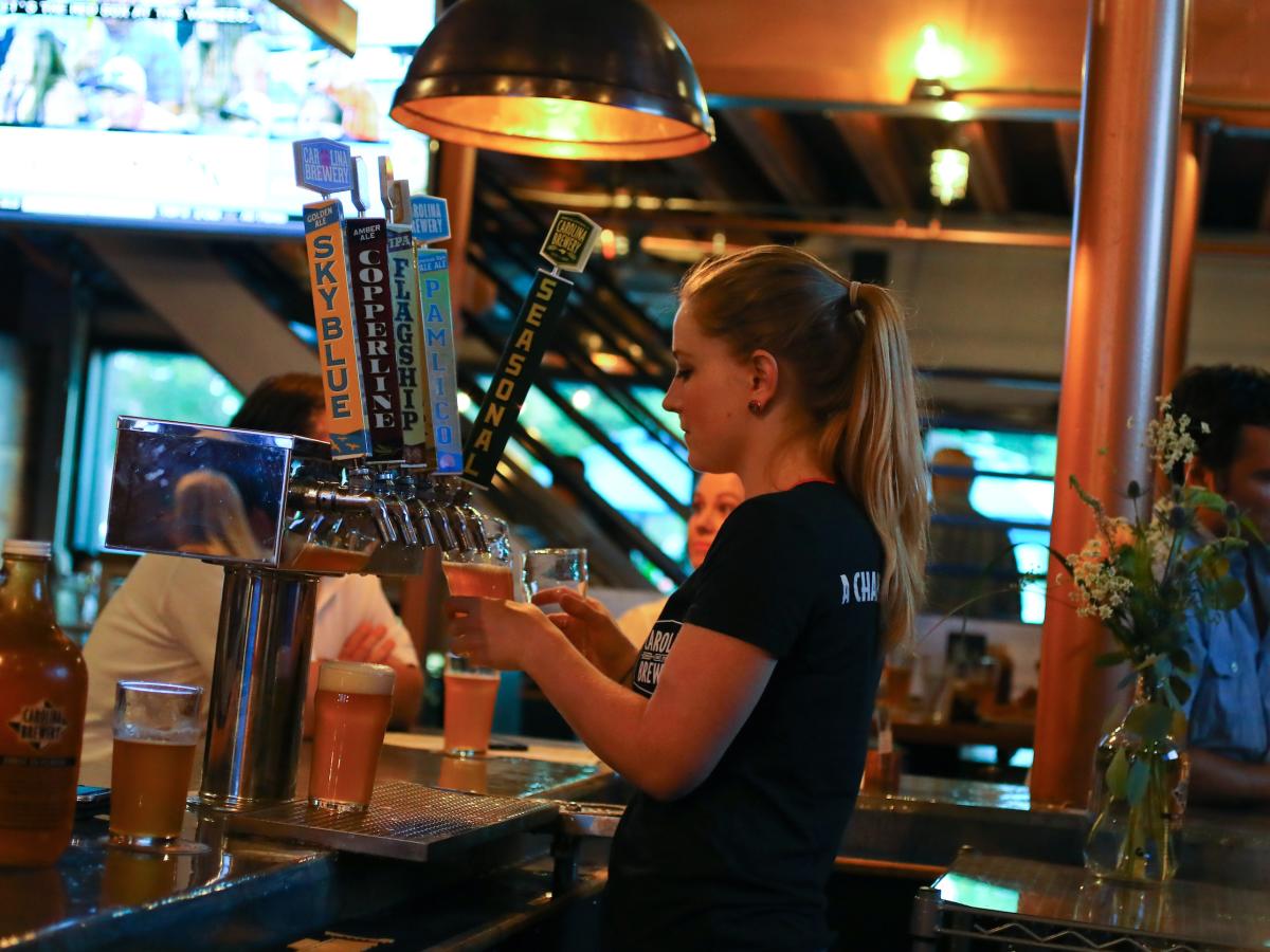 Carolina Brewery Bartender Pouring Draft Beer