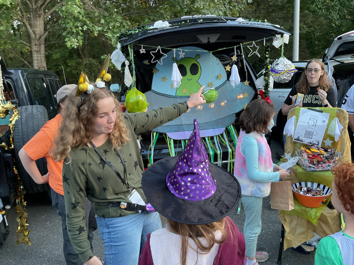 Trick or Treaters visiting the Martian themed trunk for treats