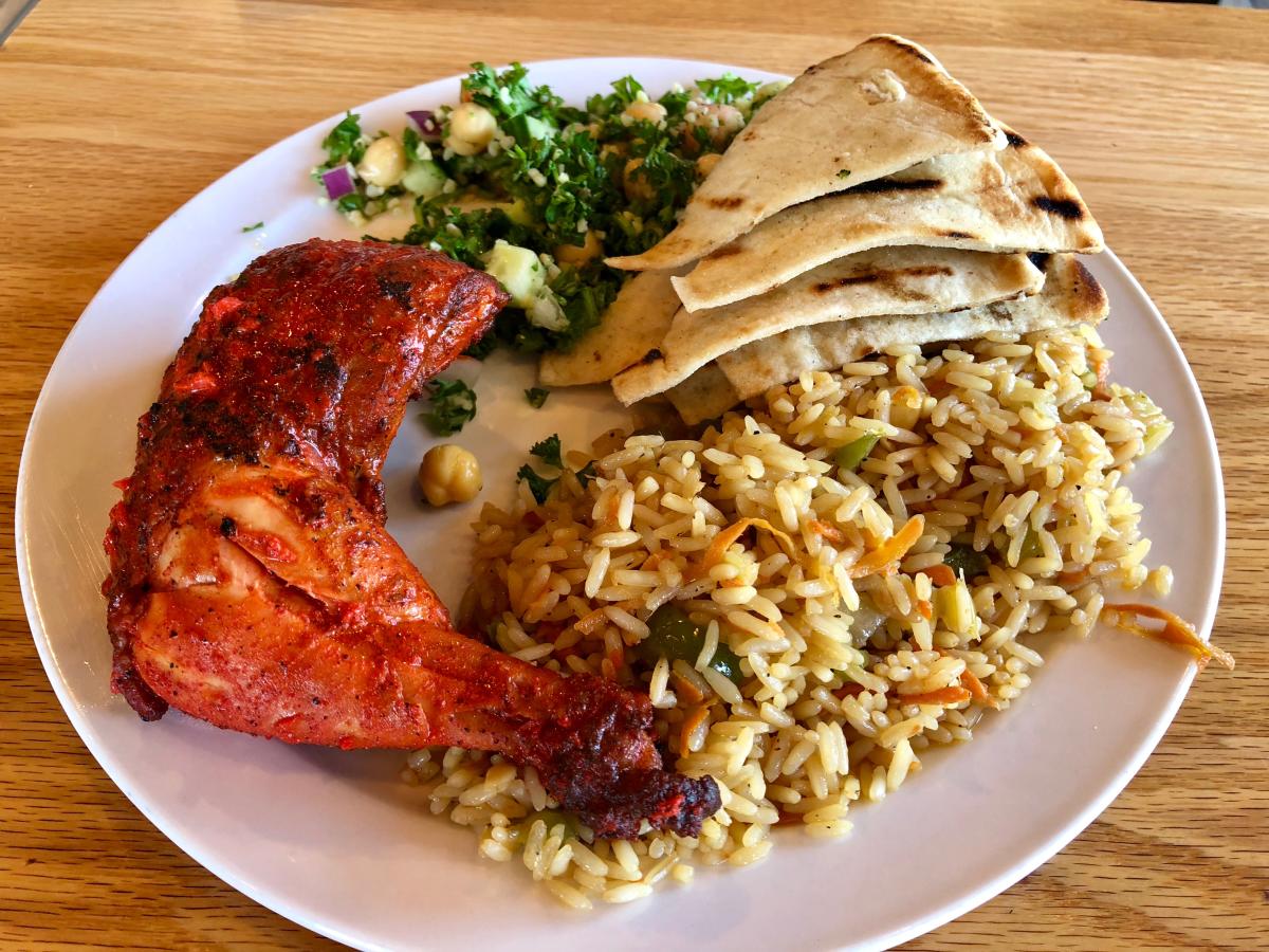 platter of chicken and sides with an international flair