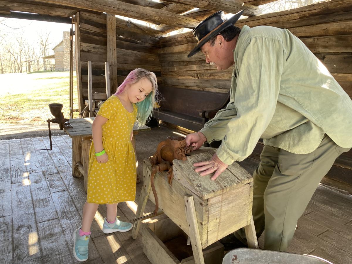 girl at a demonstration about pioneer life