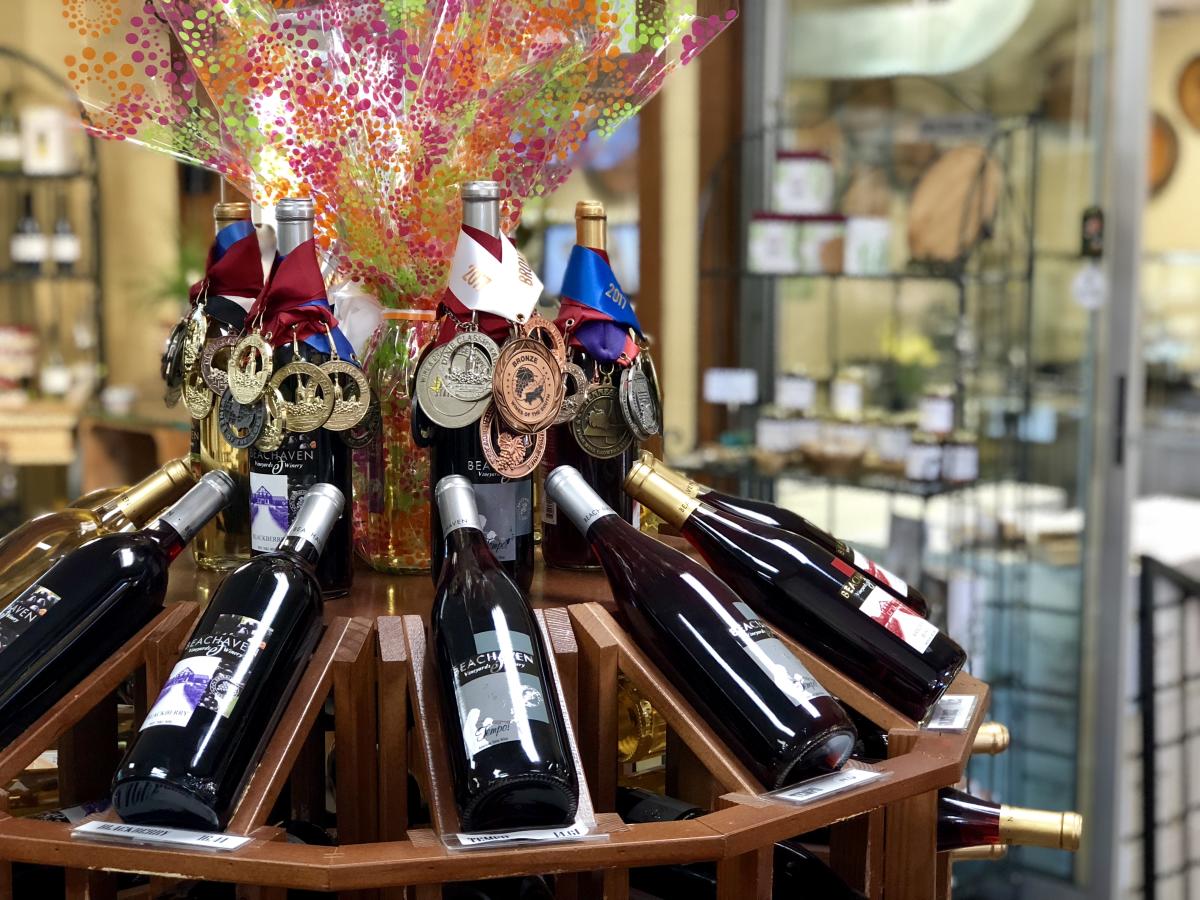 bottles and medals sit in the winery store