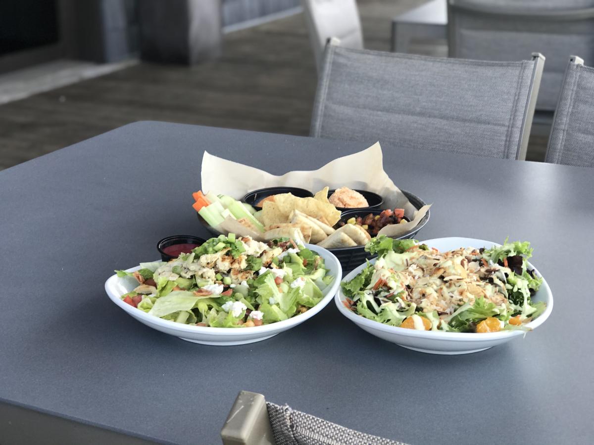 Servings of food on a patio table