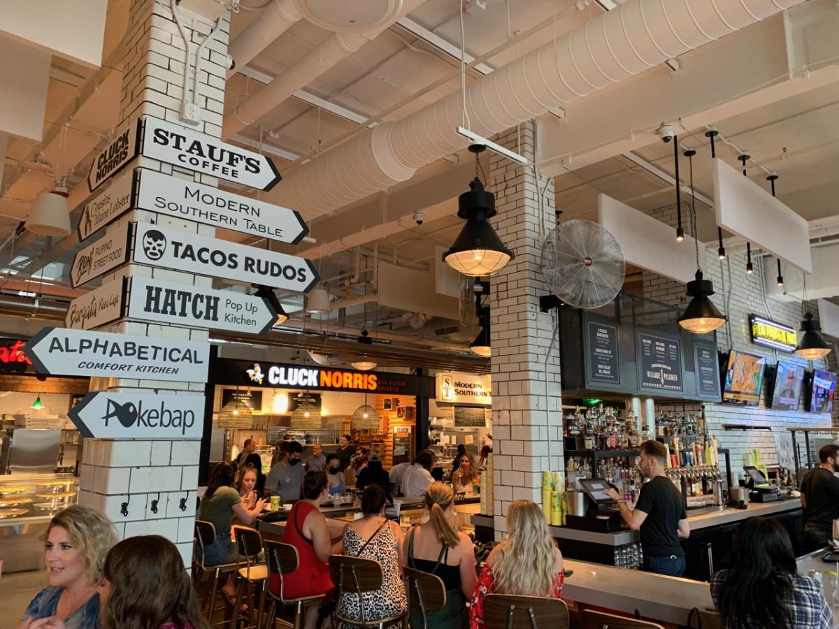 Signs lead the way for various restaurants inside Budd Dairy Food Hall