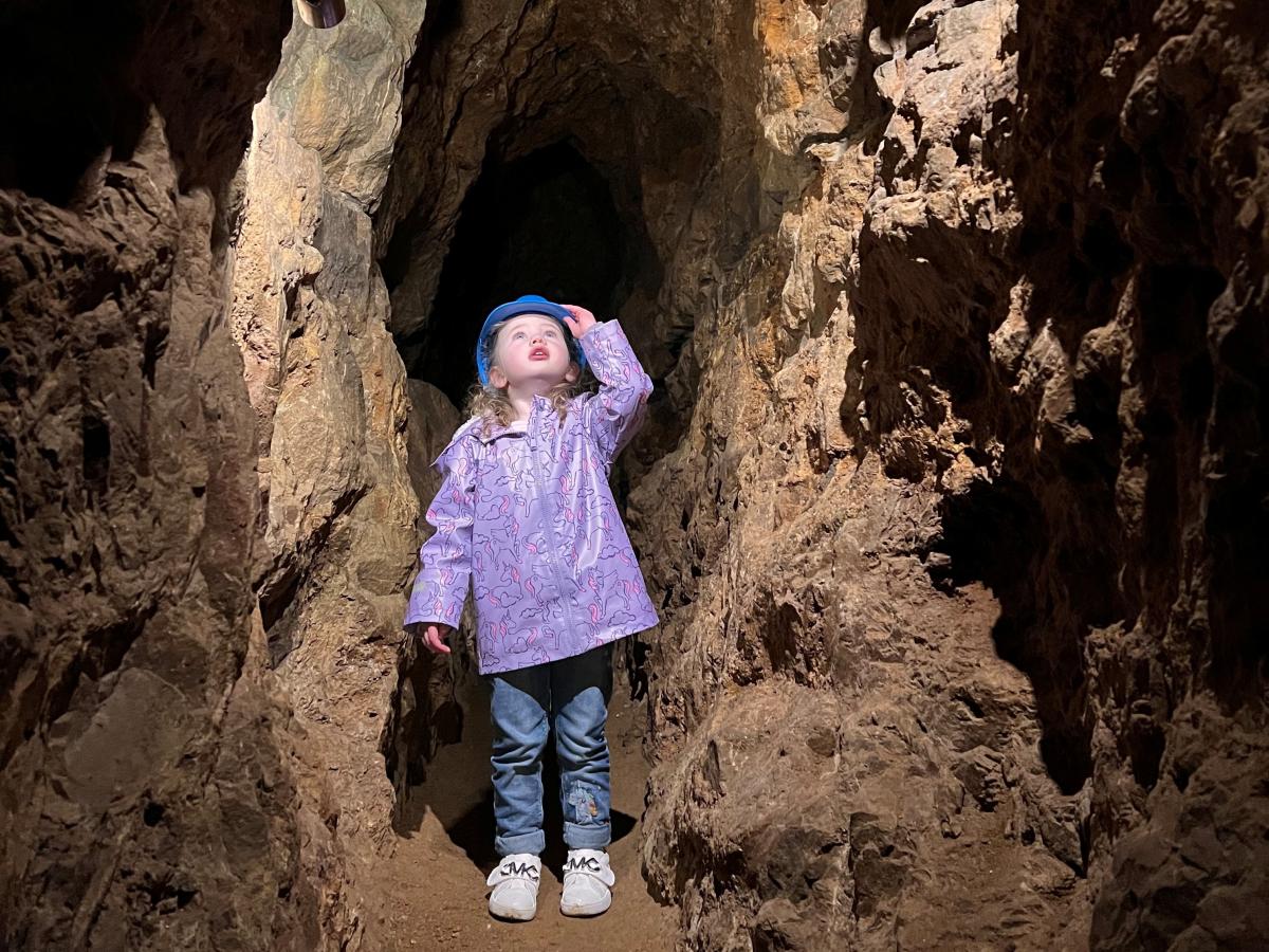 child looking up in the caves