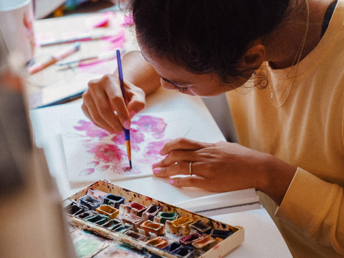 Woman painting in art class