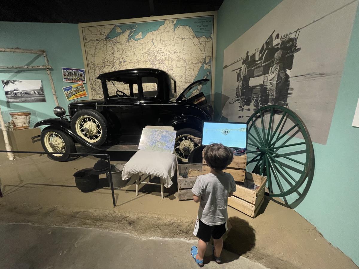 A little boy looking at an exhibit at the Chippewa Valley Museum