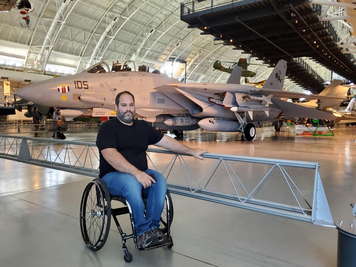 Abe in front of a Tom Cat plane at the Steven F. Udvar-Hazy Center in Fairfax County, VA