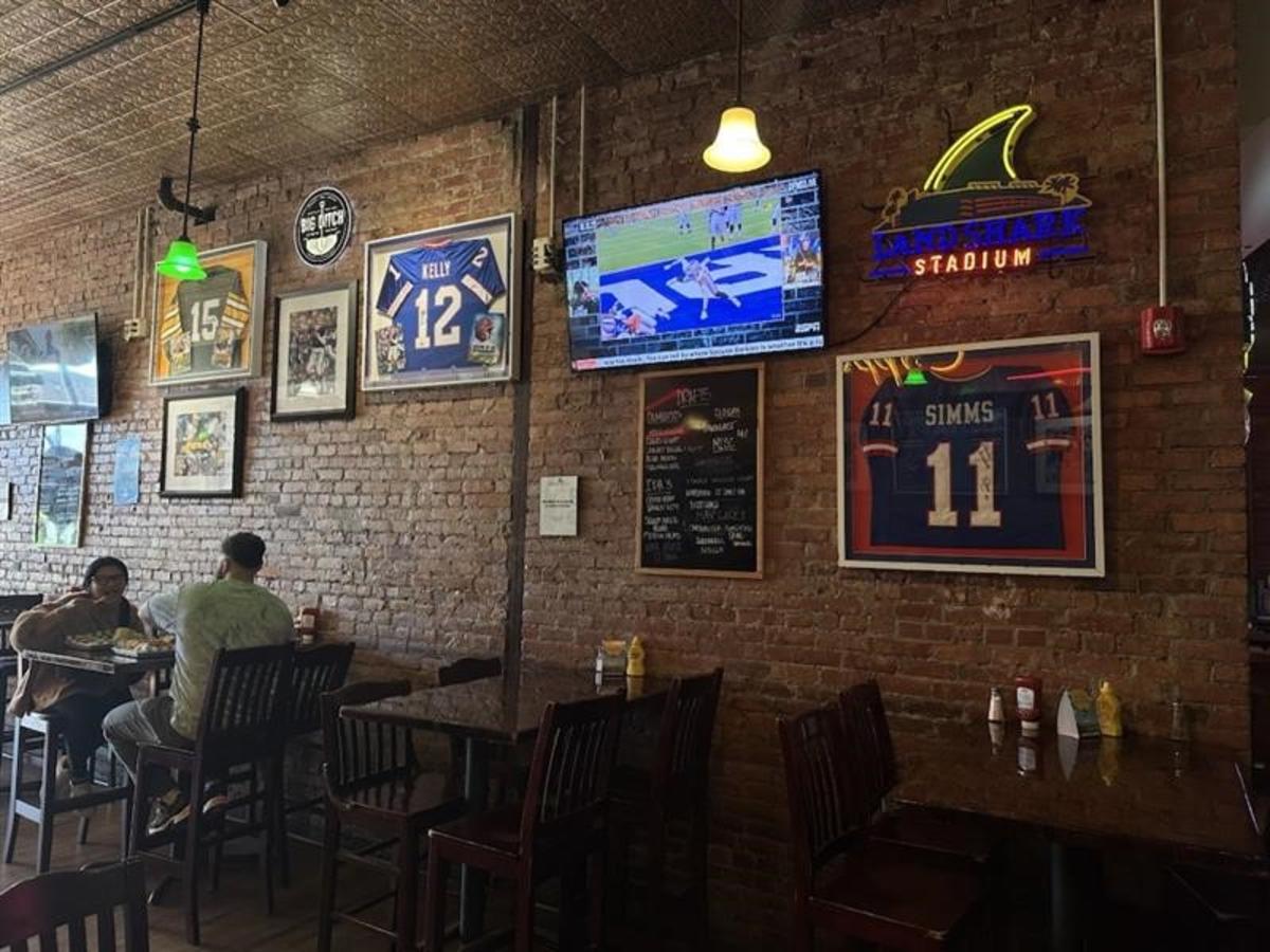Interior shot of Eddie Obriens in Geneva NY with Buffalo Bills football jersey framed on the wall and football on the television
