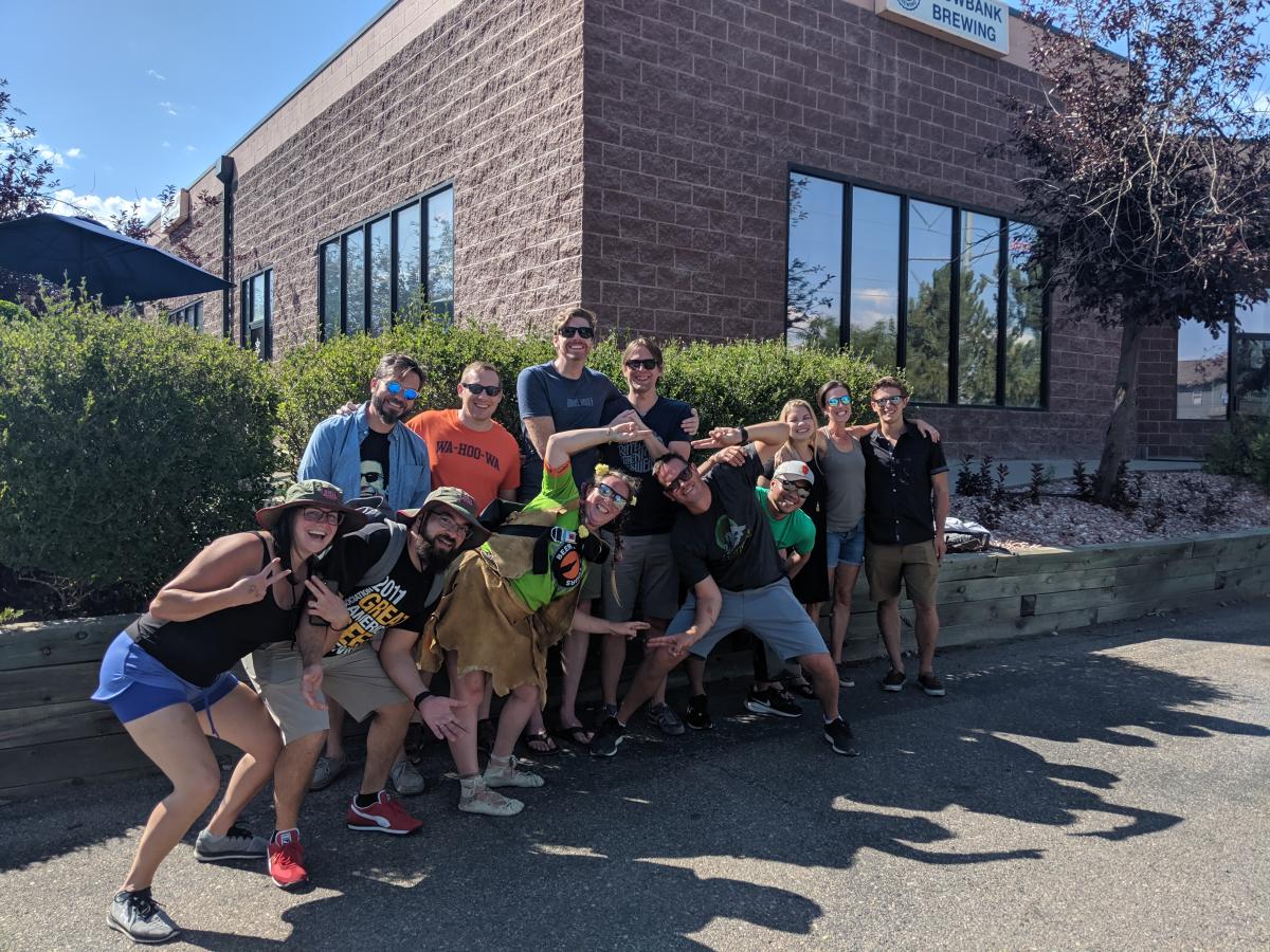 group of people posing for a group picture on beer and bike tour