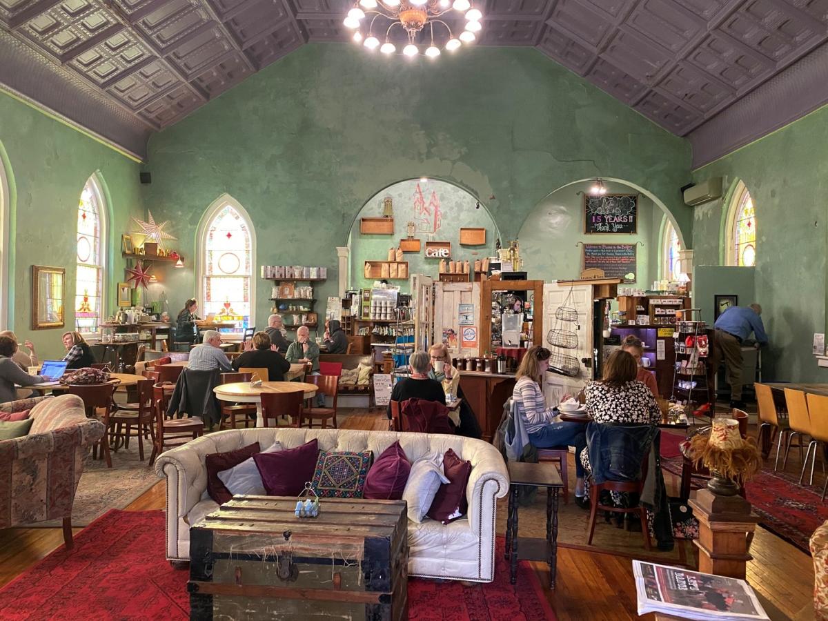 Cozy seating area with sofas and chairs inside Beans in the Belfry