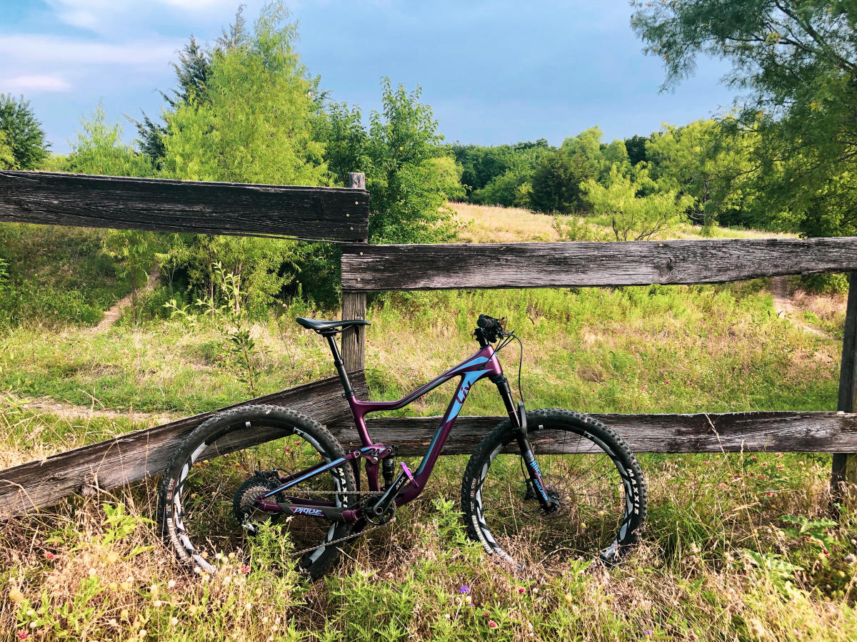 Biking leaning up against fence at the Frisco Mountain Bike Trail