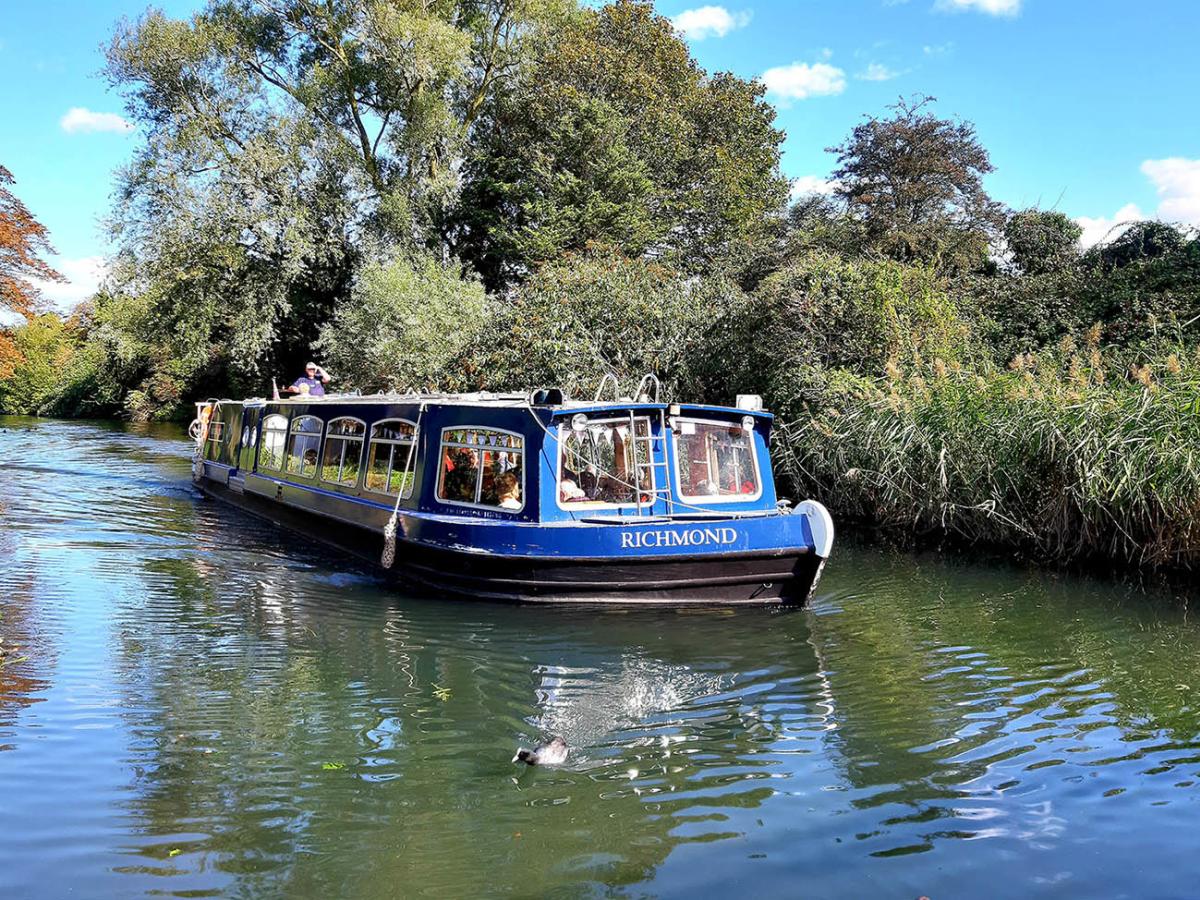 a canal boat sailing along Chichester Canal