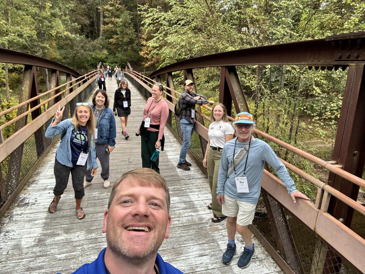 A group of convention attendees tour outdoor spaces near Harrisburg.