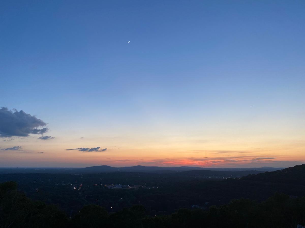Skyline At Dusk With Mountains In The Distance