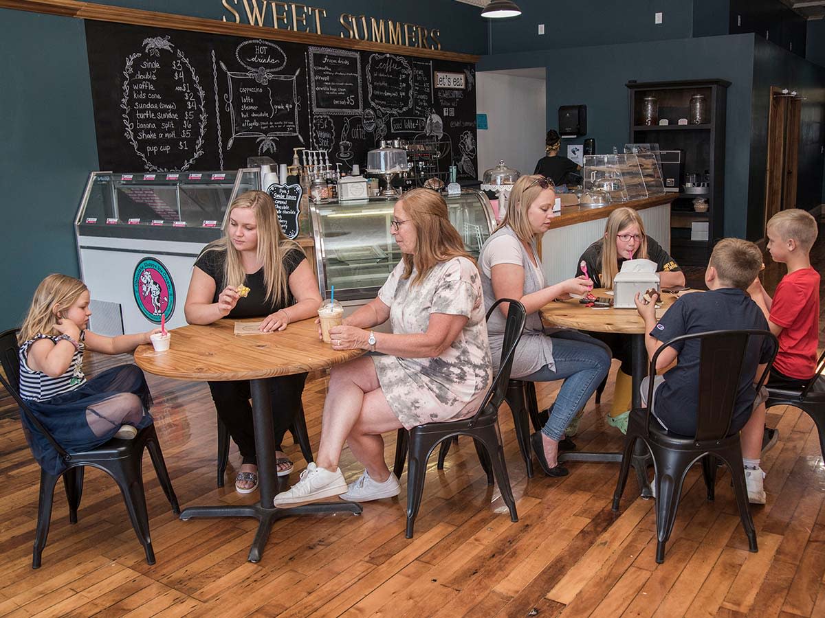 A group of people enjoying ice cream in Sweet Summers ice cream parlor in Steuben County.