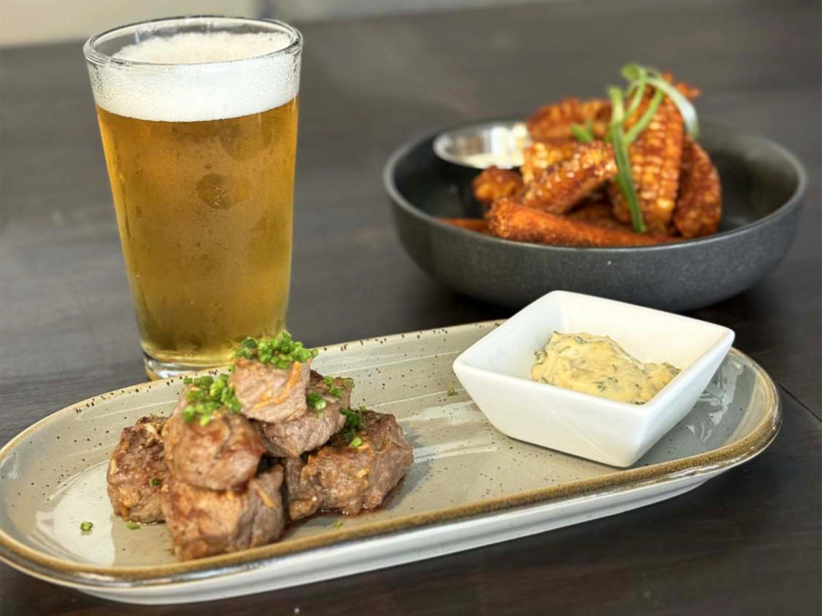 Crescendo appetizers and beer on tabletop at The Station Clayton