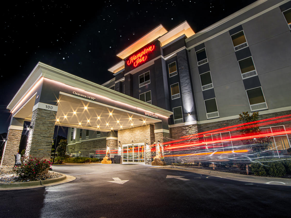 The Hampton Inn in Benson is lit up at night as a car pulls in for the night.