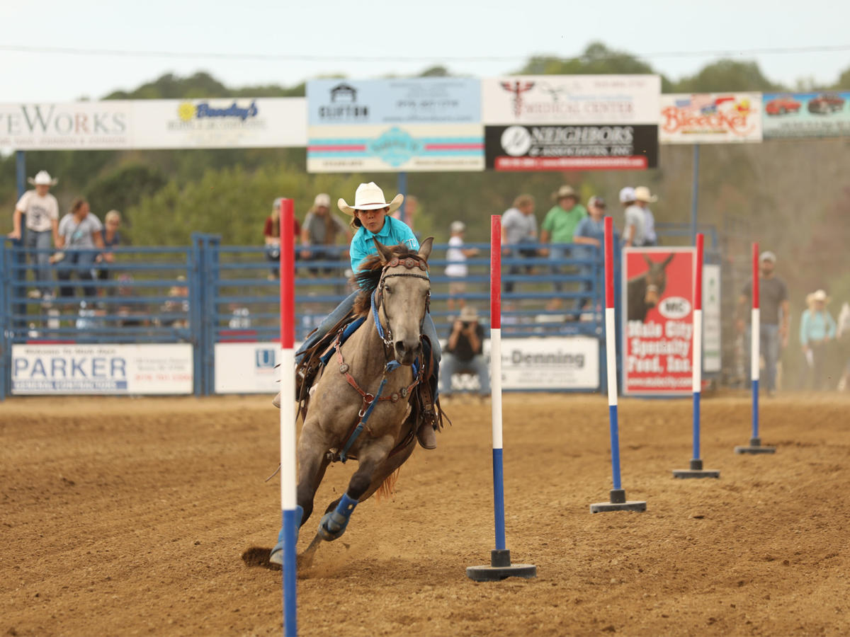 Girl and mule compete in event at Mule Days in Benson, NC.