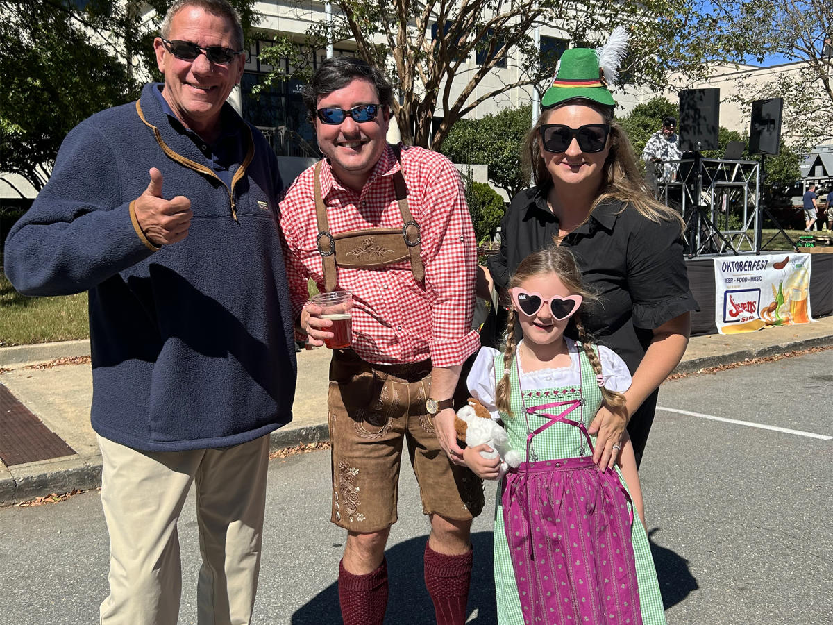Group of People Gathered for Downtown Smithfield's Oktoberfest - some in German-inspired costumes