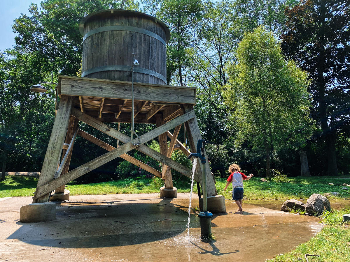 A child playing at the Kalamazoo Nature Center Playground