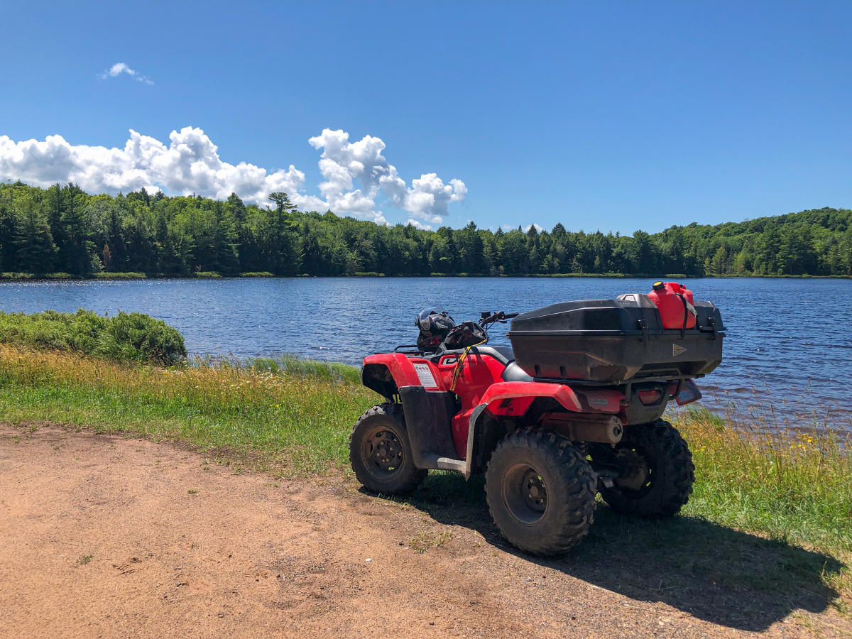 ATV parked in front of Boston Pond