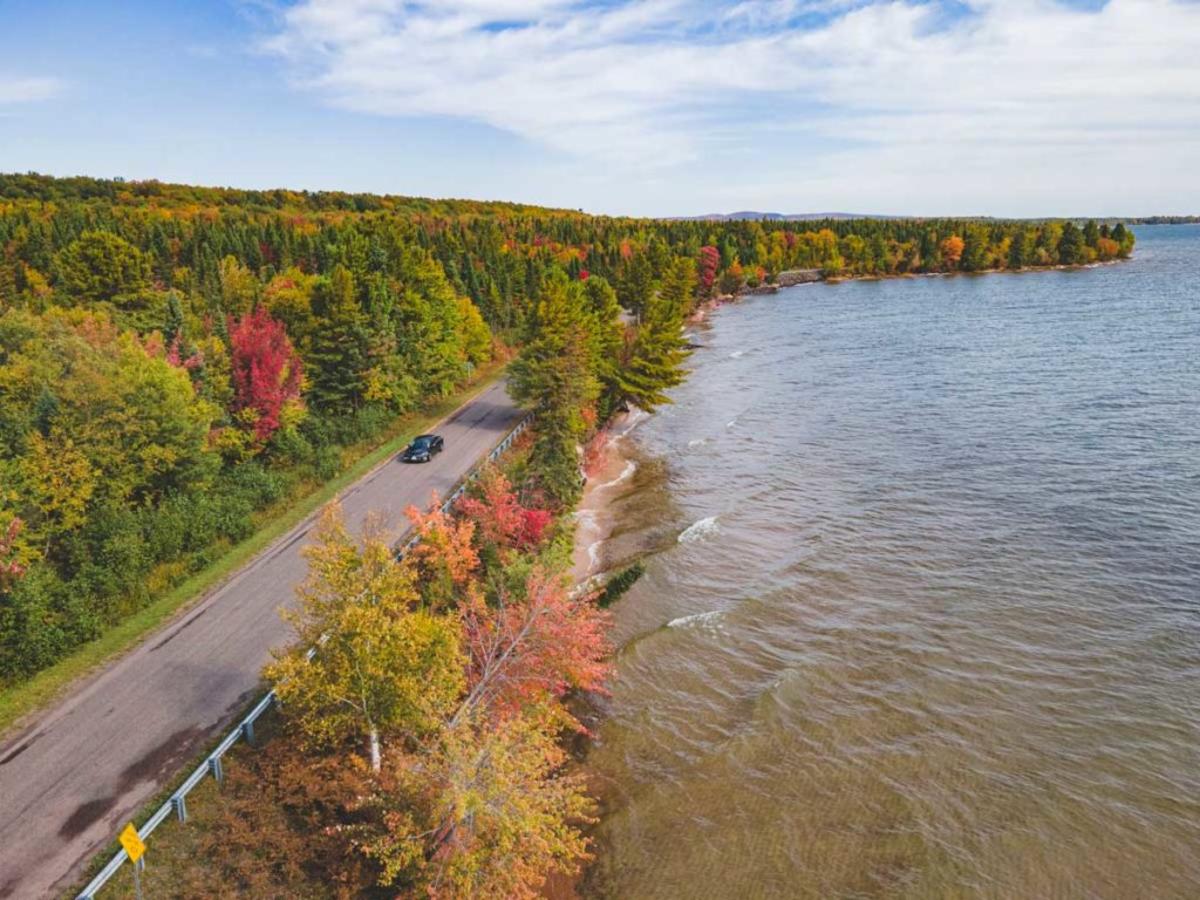 Car taking scenic drive in Keweenaw Peninsula during Fall