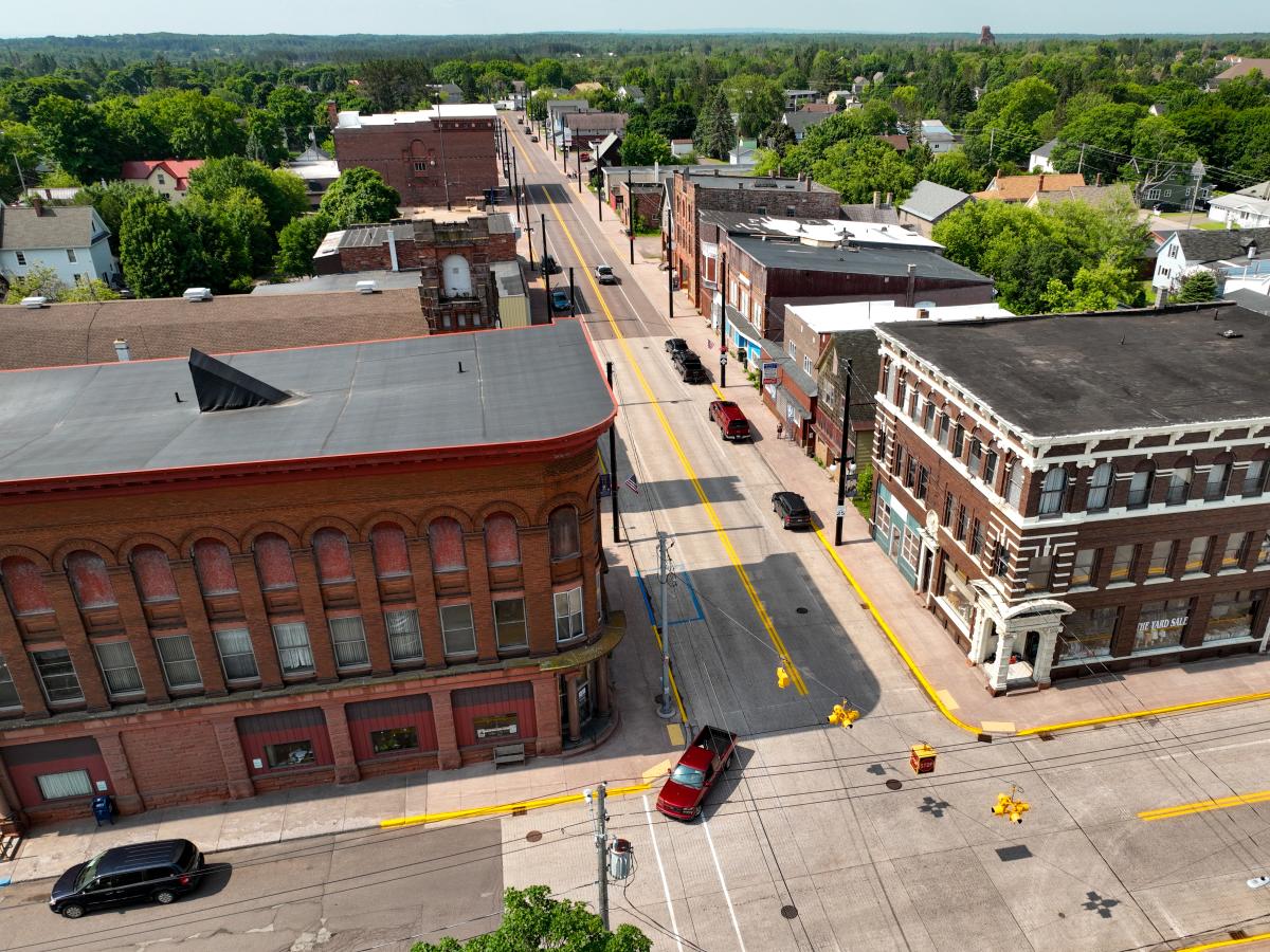 aerial drone view of the rural small town main street of laurium