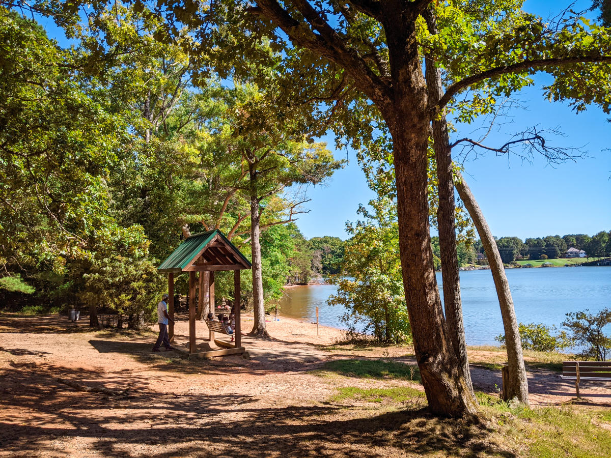 People Enjoying Latta Nature Preserve By The Lake