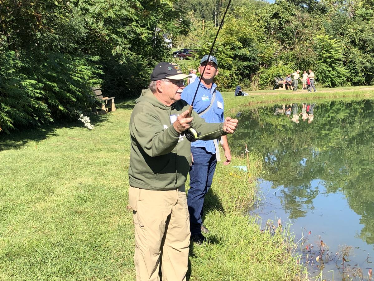 Veteran Fred Exley gets a tip from Trout Unlimited mentor Steve Shirley during the  fifth annual Forbes Trail Trout Unlimited fishing event for military veterans and first responders.