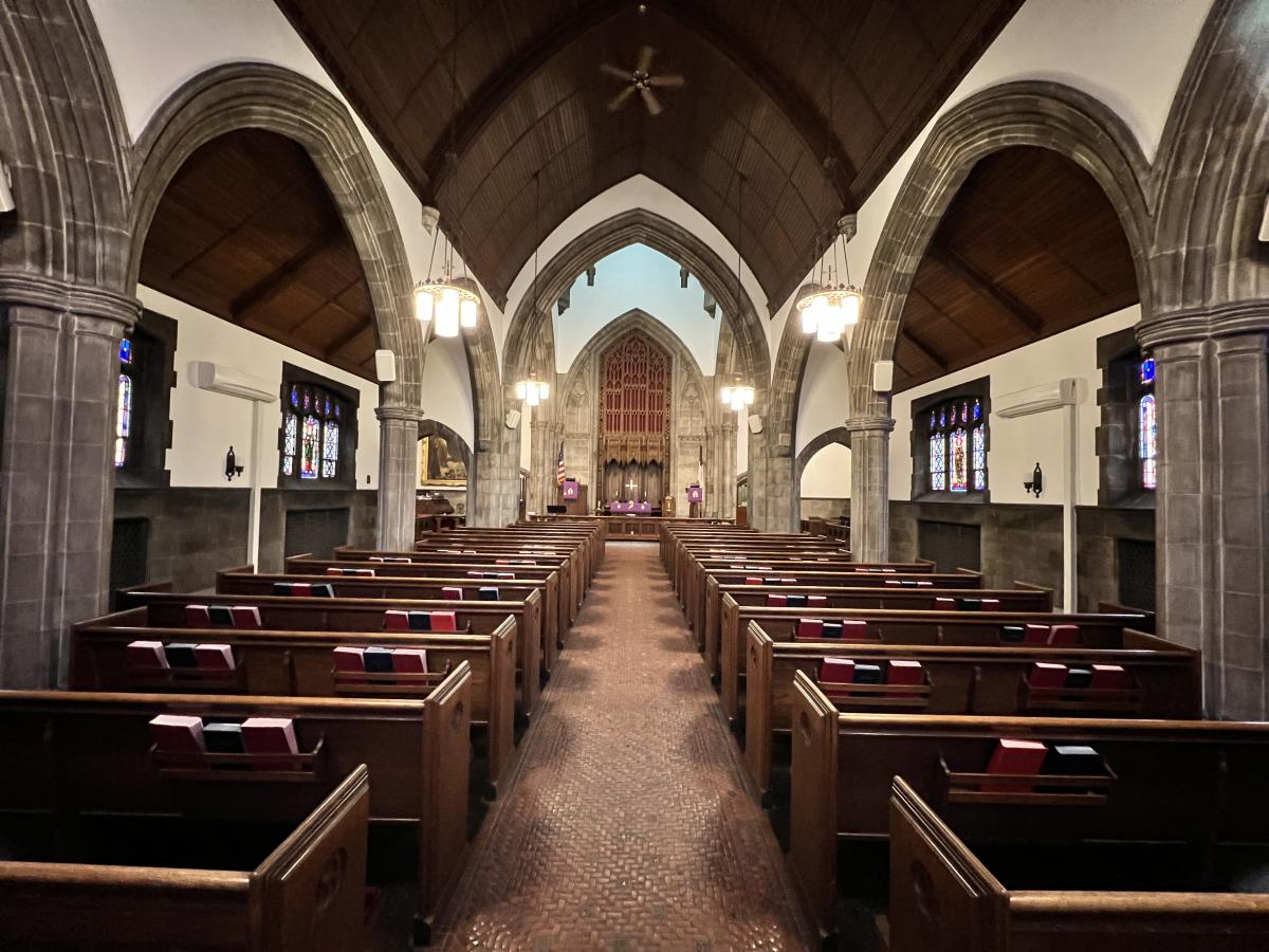 The sanctuary of Phillip G. Cochran Memorial United Methodist Church features soaring arches and beautiful wooden pews.